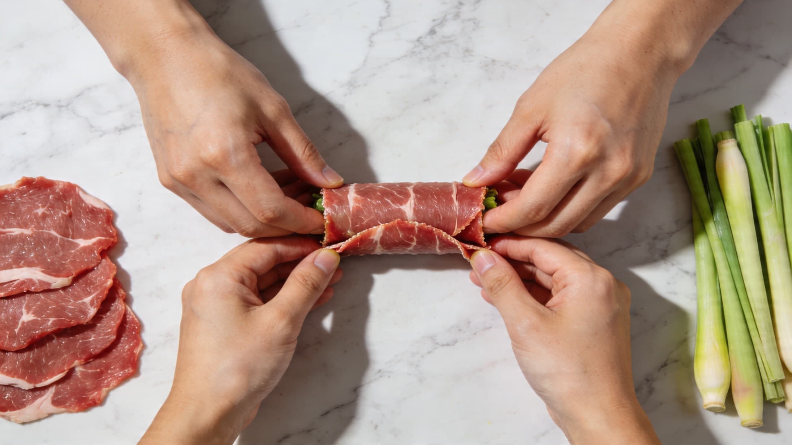 Image 1: A close-up, step-by-step demonstration of the "Tuck and Tension" rolling technique on a marble countertop with thinly sliced veal and fresh lemongrass stalks nearby.