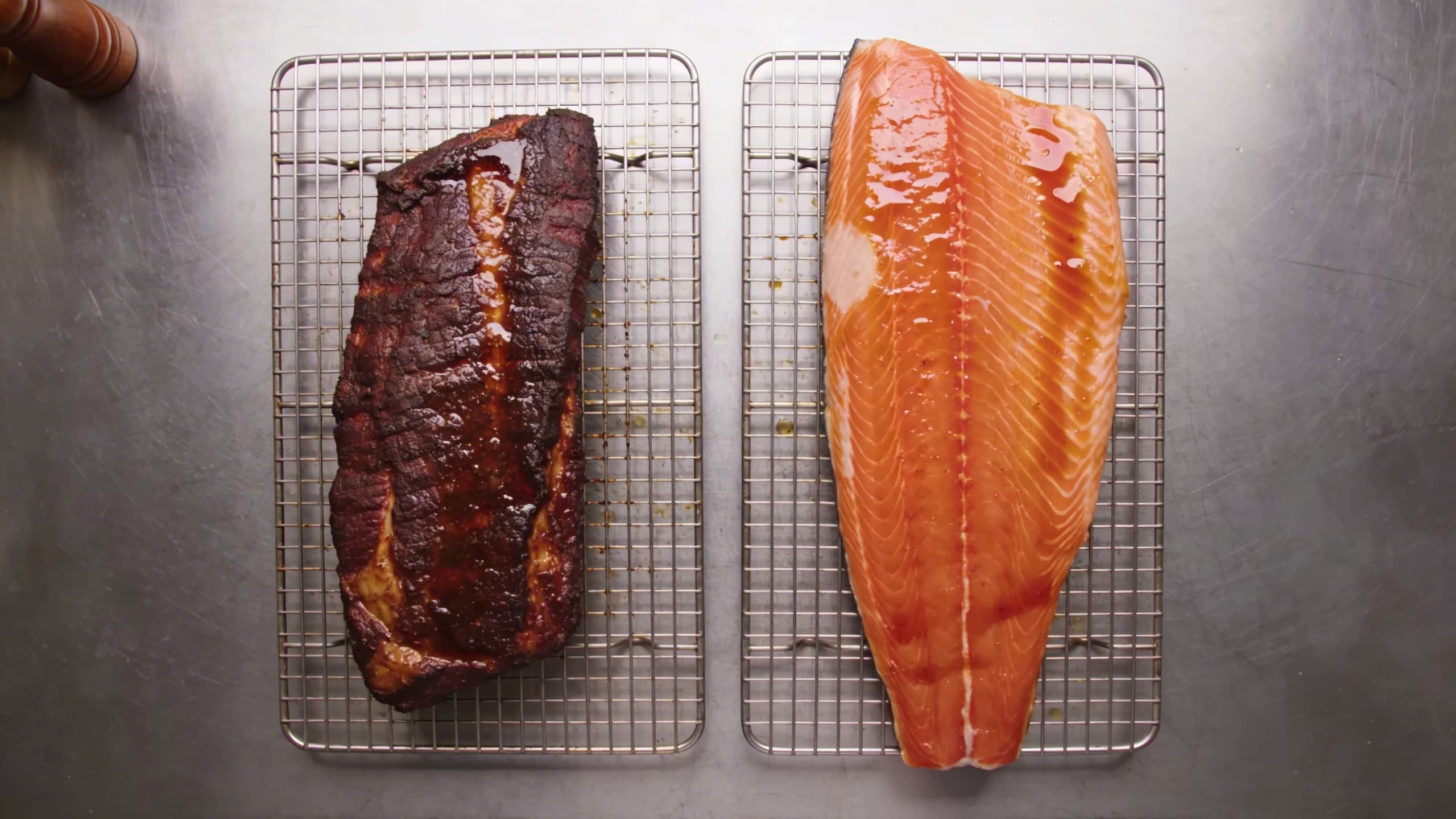 A perfectly formed tacky pellicle on a side of salmon and a trimmed brisket, showing the subtle sheen before hitting the smoker.